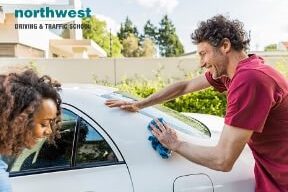 New car owners cleaning car