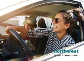 driver wearing glasses driving together in a car